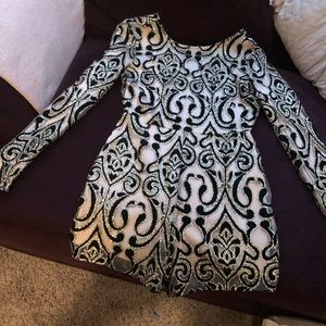 Women’s one piece tan black and gold outfit